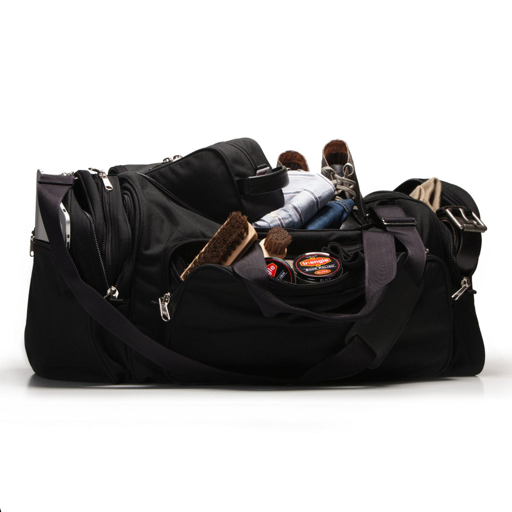 Black duffel bag with various items on a white background