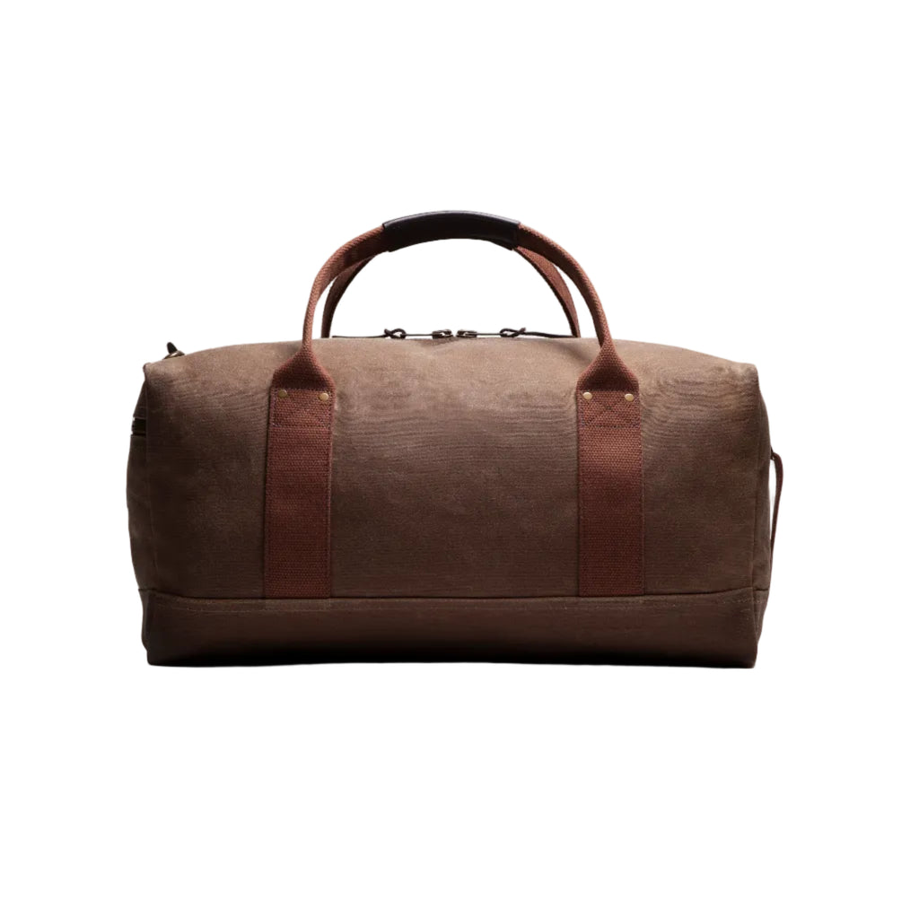 Brown duffel bag with leather accents on a white background