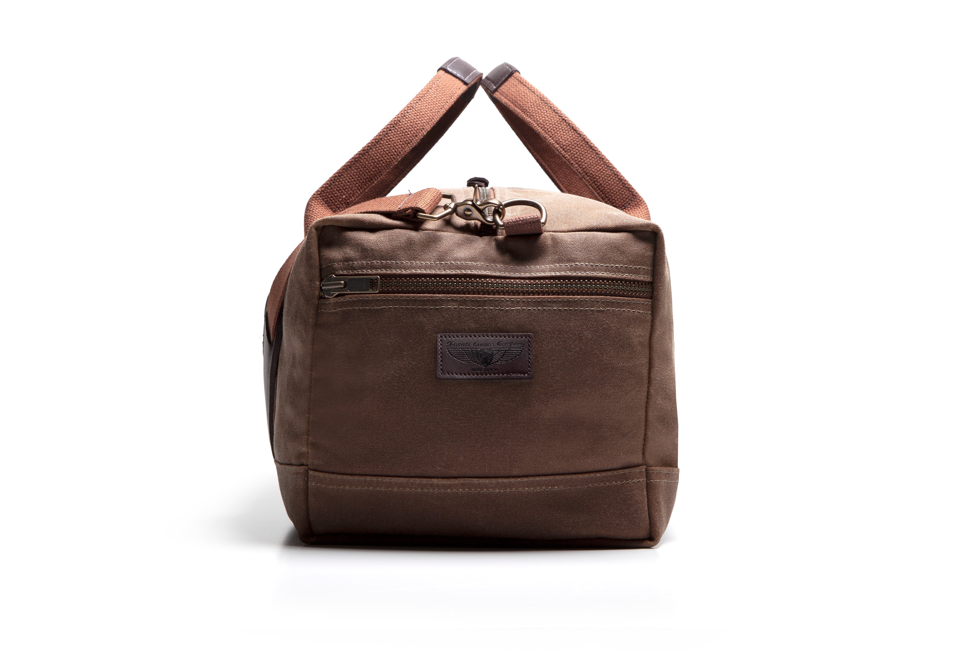 Brown duffel bag with leather handles on a white background