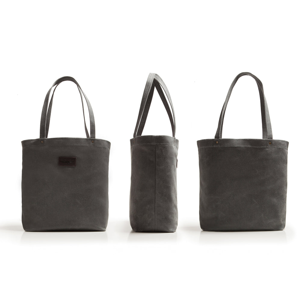 Three black tote bags of different sizes on a white background