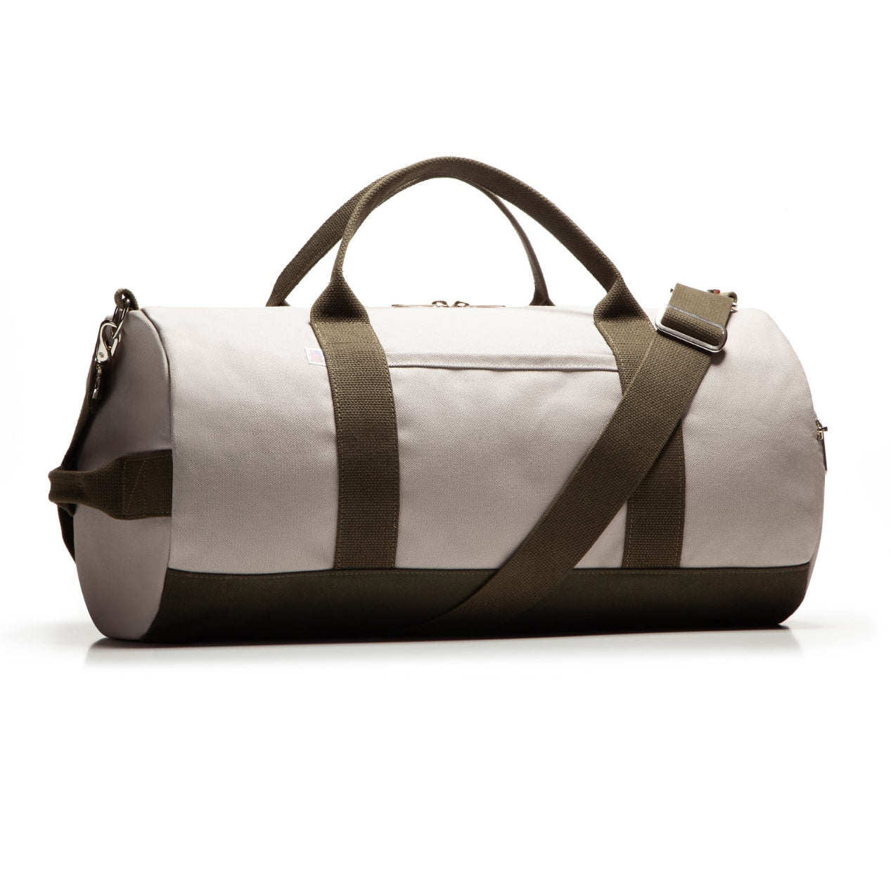 Tan duffel bag with brown straps on a white background