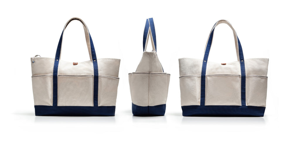 Three tote bags with blue straps and trim on a white background