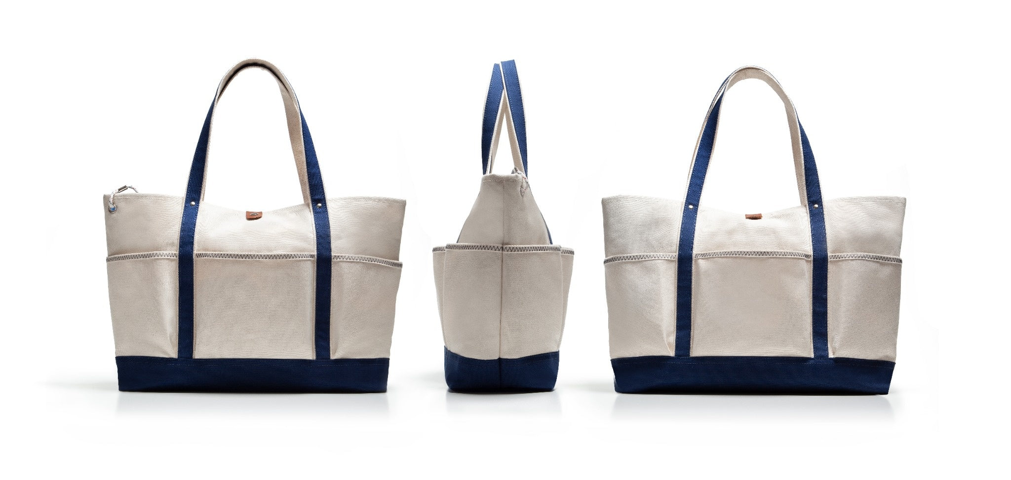 Three tote bags with blue straps and trim on a white background