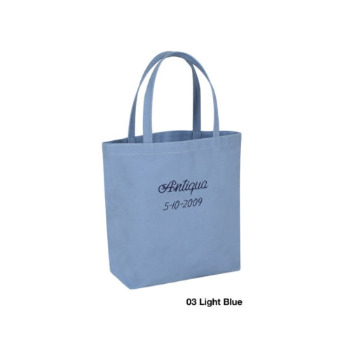 Light blue tote bag with 'Antiqua' and a date printed on it, against a white background.