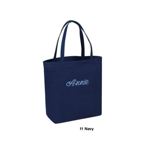 Navy tote bag with 'Annie' embroidered on it against a white background