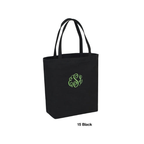 Black tote bag with green monogram on a white background