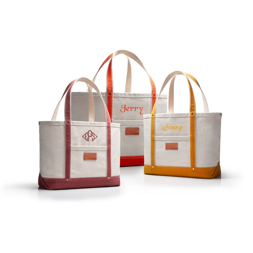 Three heavy duty duck canvas tote bags with monogrammed text on a white background
