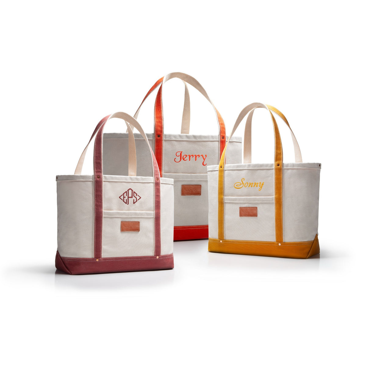 Three heavy duty duck canvas tote bags with monogrammed text on a white background