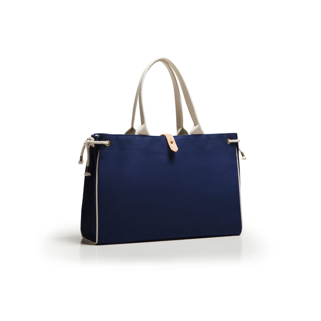 Blue handbag with beige handles on a white background