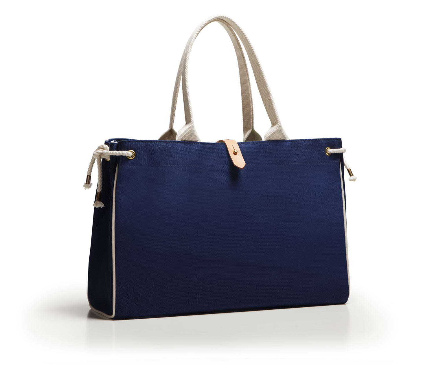 Blue handbag with beige handles on a white background