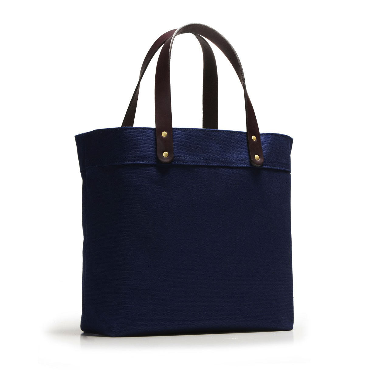 Navy blue tote bag with brown handles on a white background
