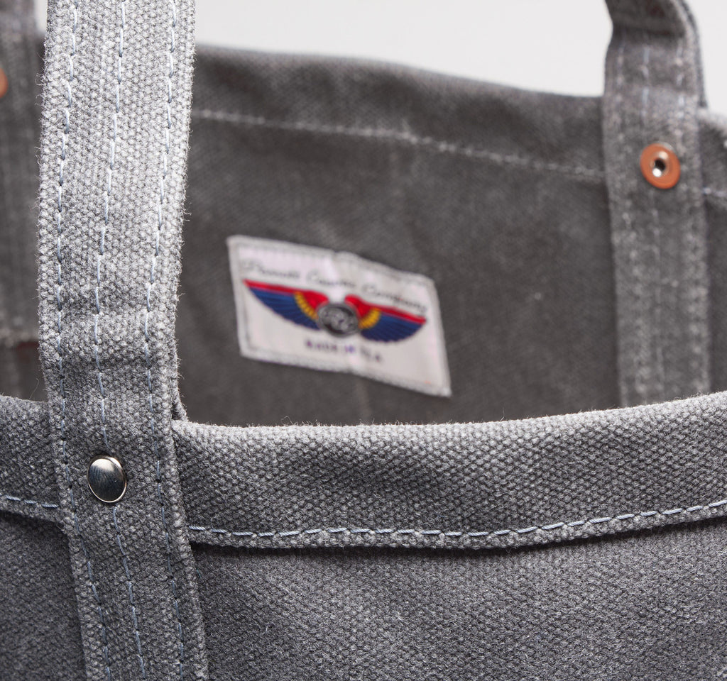Gray apron with a brand logo on a white background