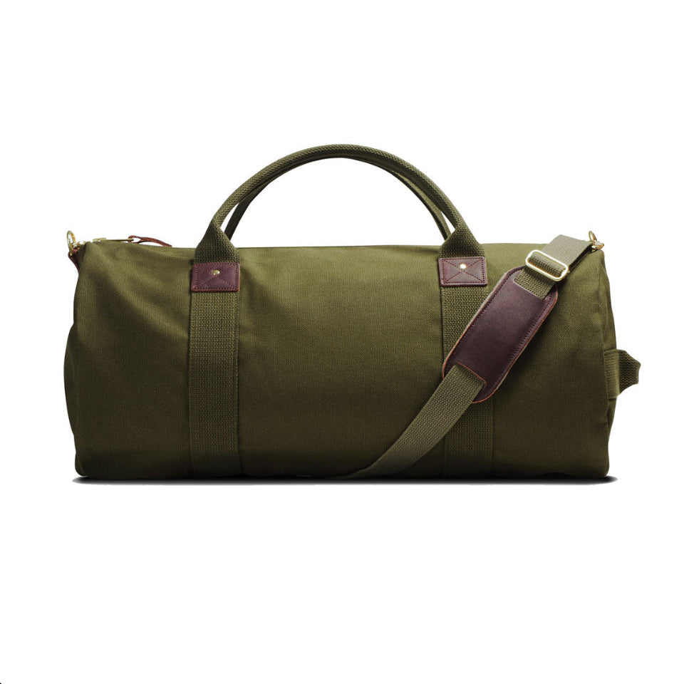 Green duffel bag with a brown strap on a white background