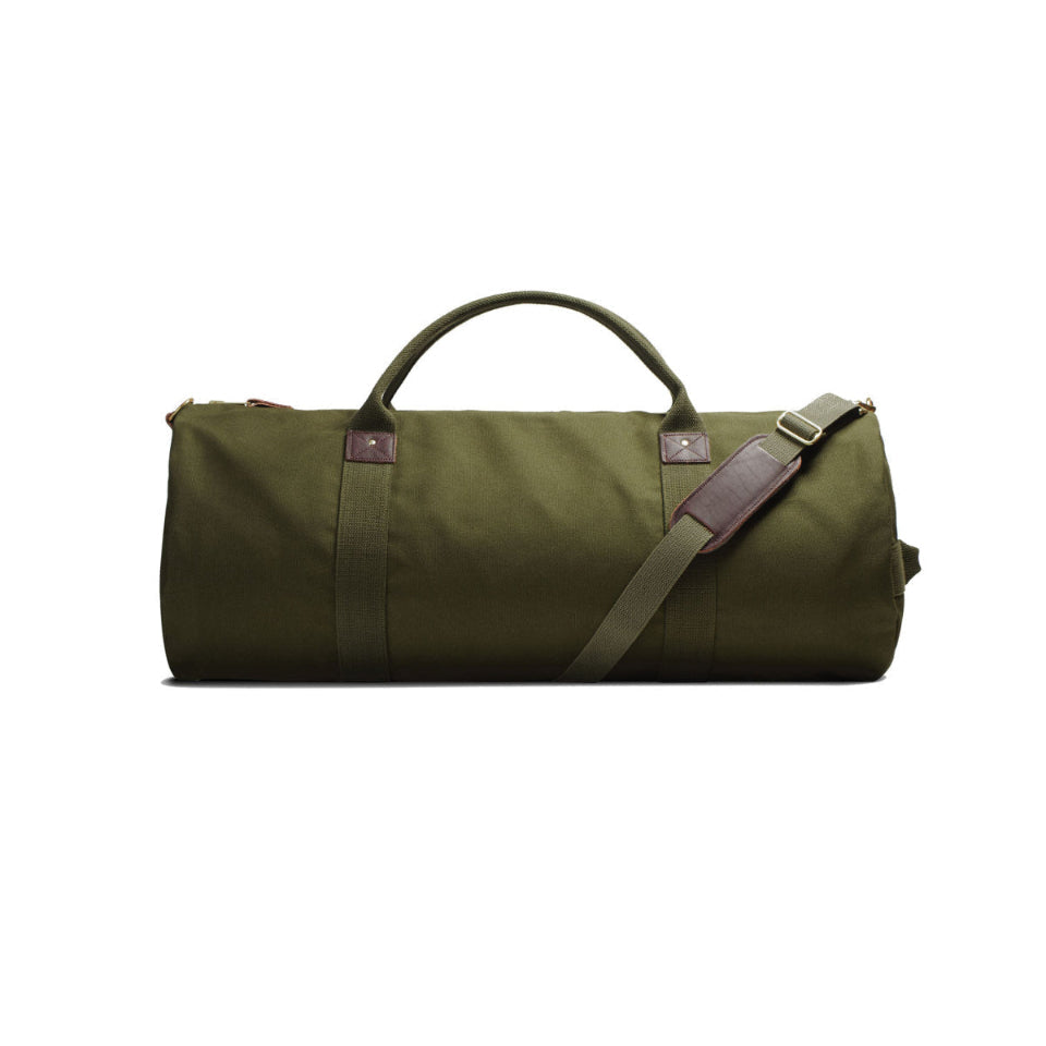 Green duffel bag with a shoulder strap on a white background