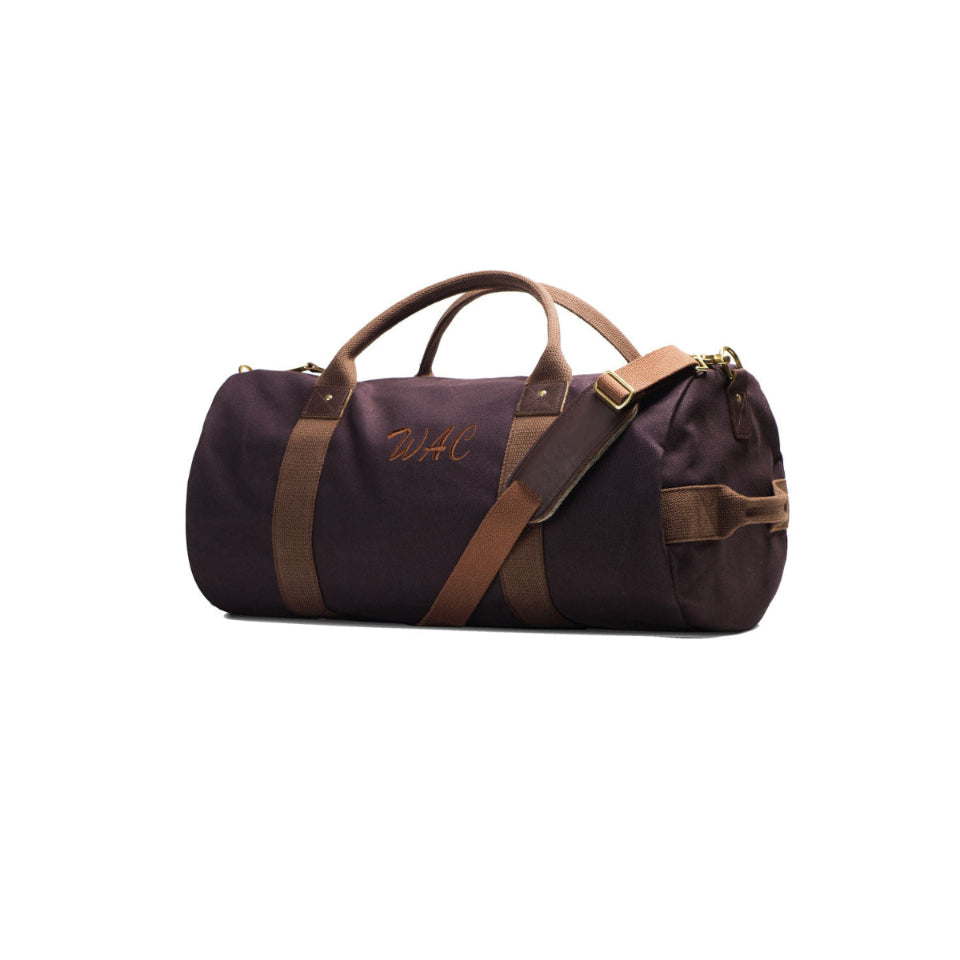 Brown duffel bag with brown straps on a white background