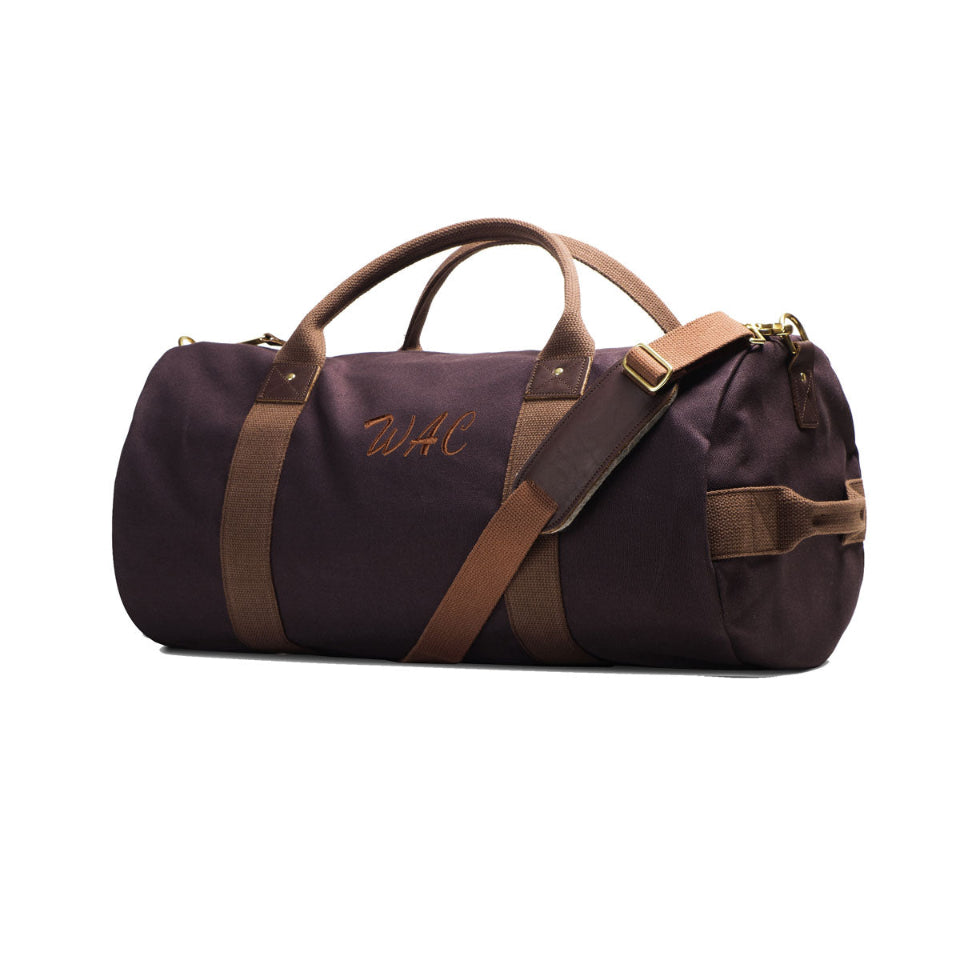 Brown duffel bag with brown straps on a white background