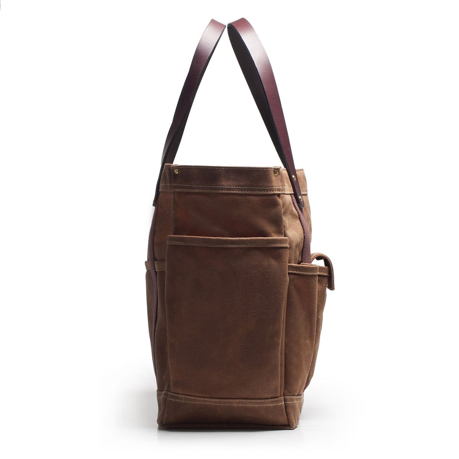 Brown leather tote bag with a strap on a white background