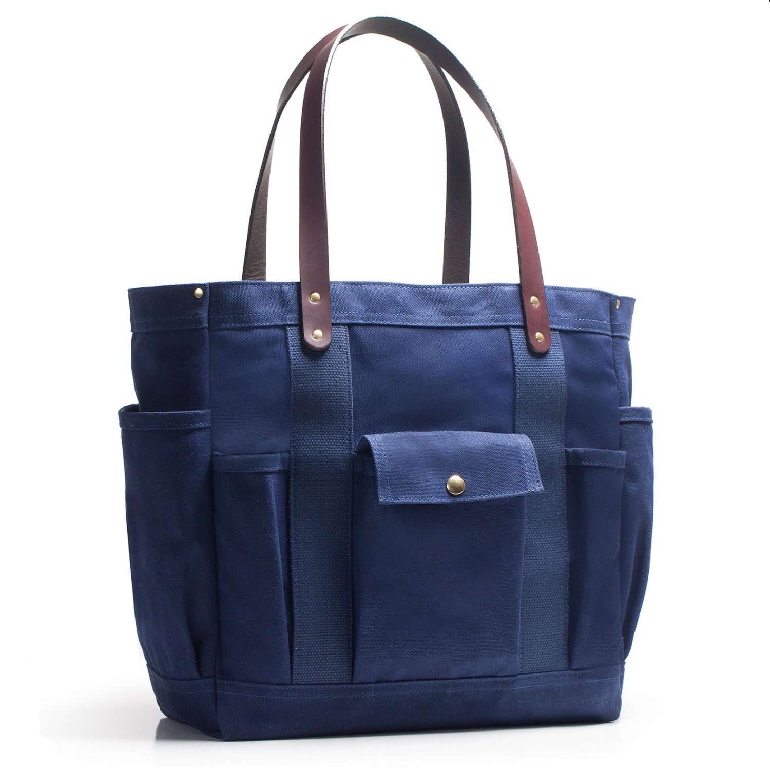 Blue tote bag with brown straps on a white background