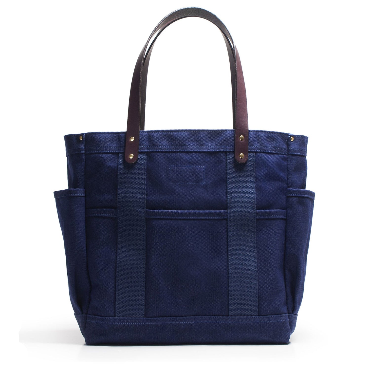 Blue tote bag with brown handles on a white background