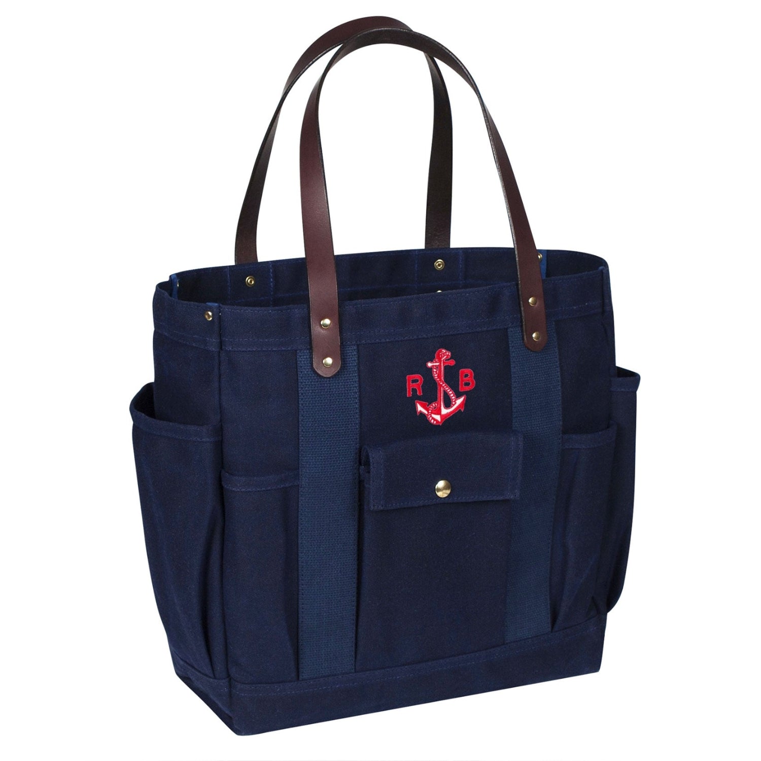 Navy tote bag with brown handles and red anchor design on a white background