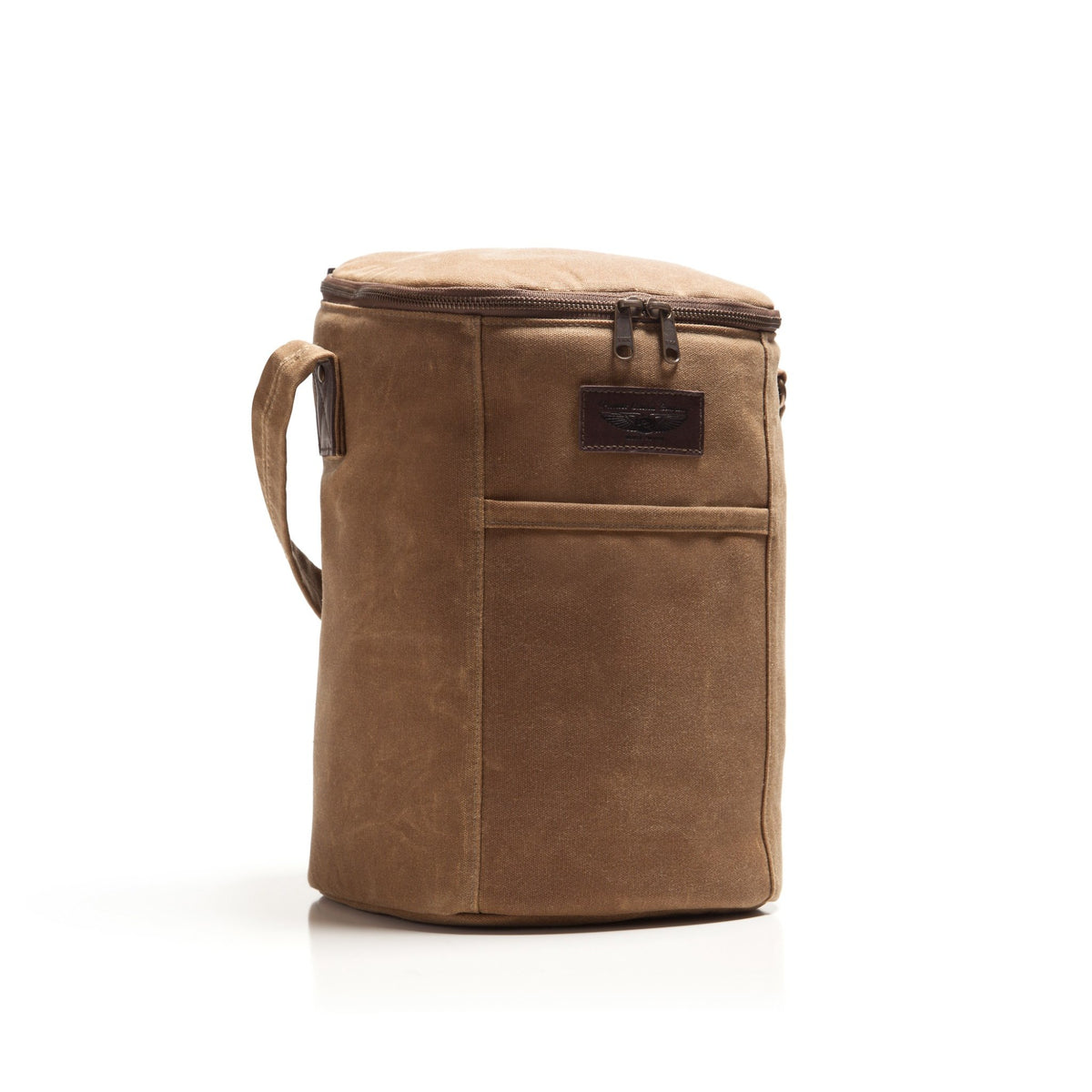 A brown canvas bourbon bag with a top zipper, carrying handle, and a small dark brown brand patch on the front, shown on a clean white background.